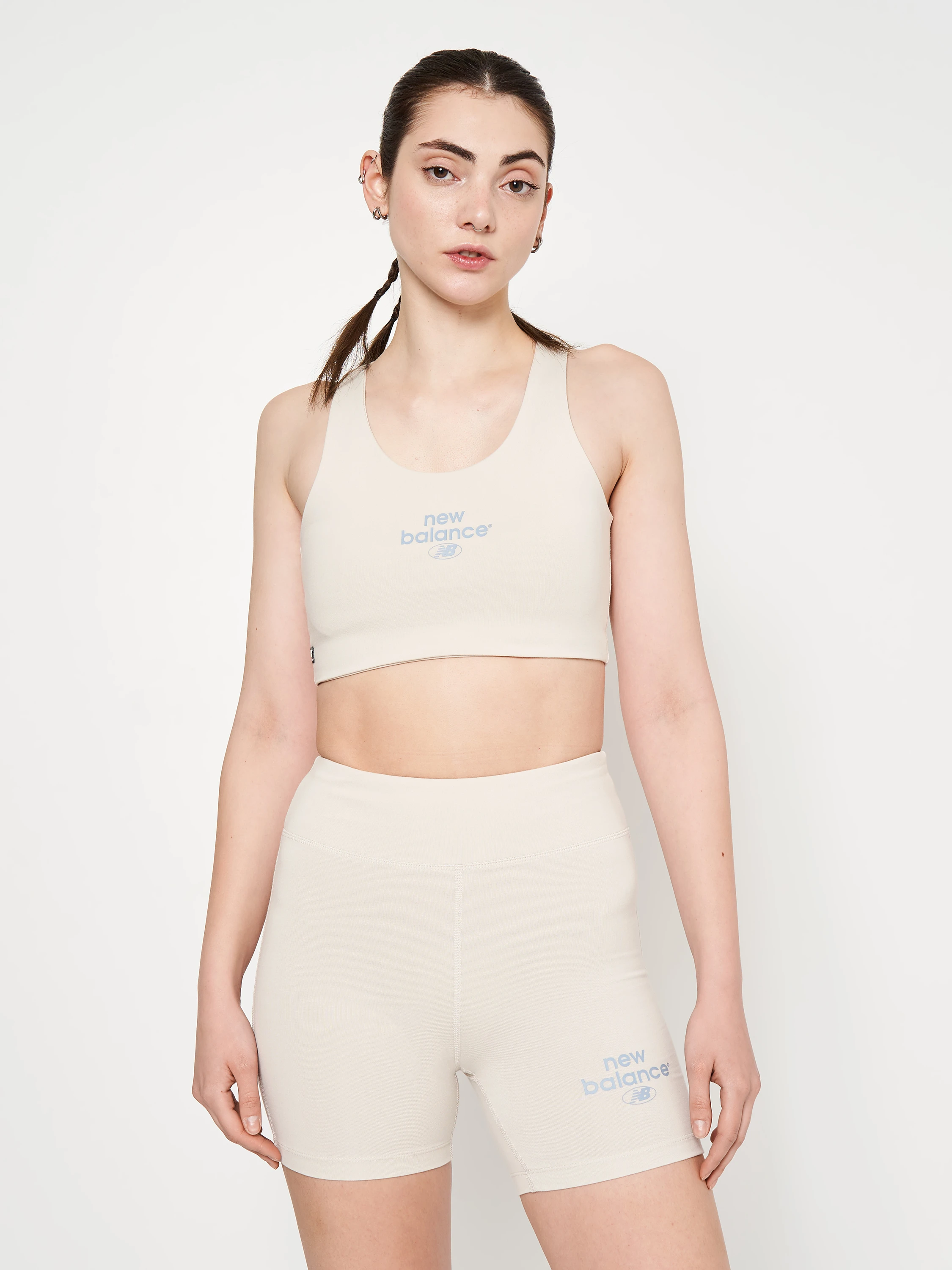 Спортивний топ жіночий New Balance Essentials Reimagined Bra White (WB31500MBM) — фото 1